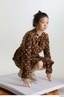 Aera  1 brown dots dress casual dressed kneeling white…